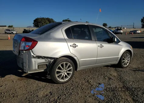 2011 Suzuki Sx4 Le z USA, uszkodzony, nr VIN JS2YC5A24B6301884